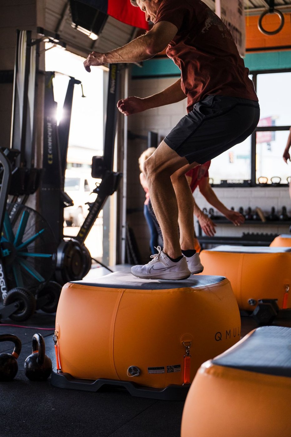Athlete doing box step-ups on the Cube